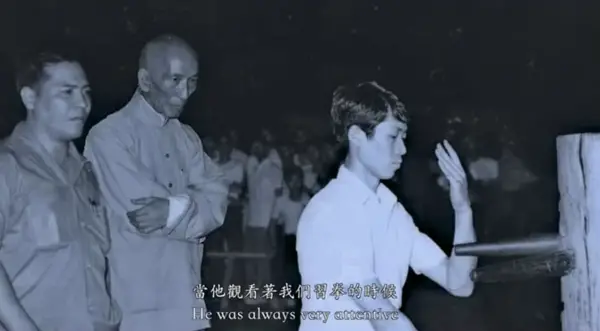 Yip Man observing his student